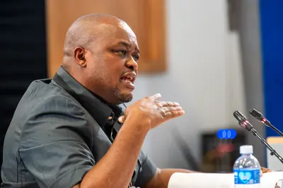 Oupa Brown Mogotsi during legal proceedings, as the State presented evidence regarding an alleged court holding cell escape plot.