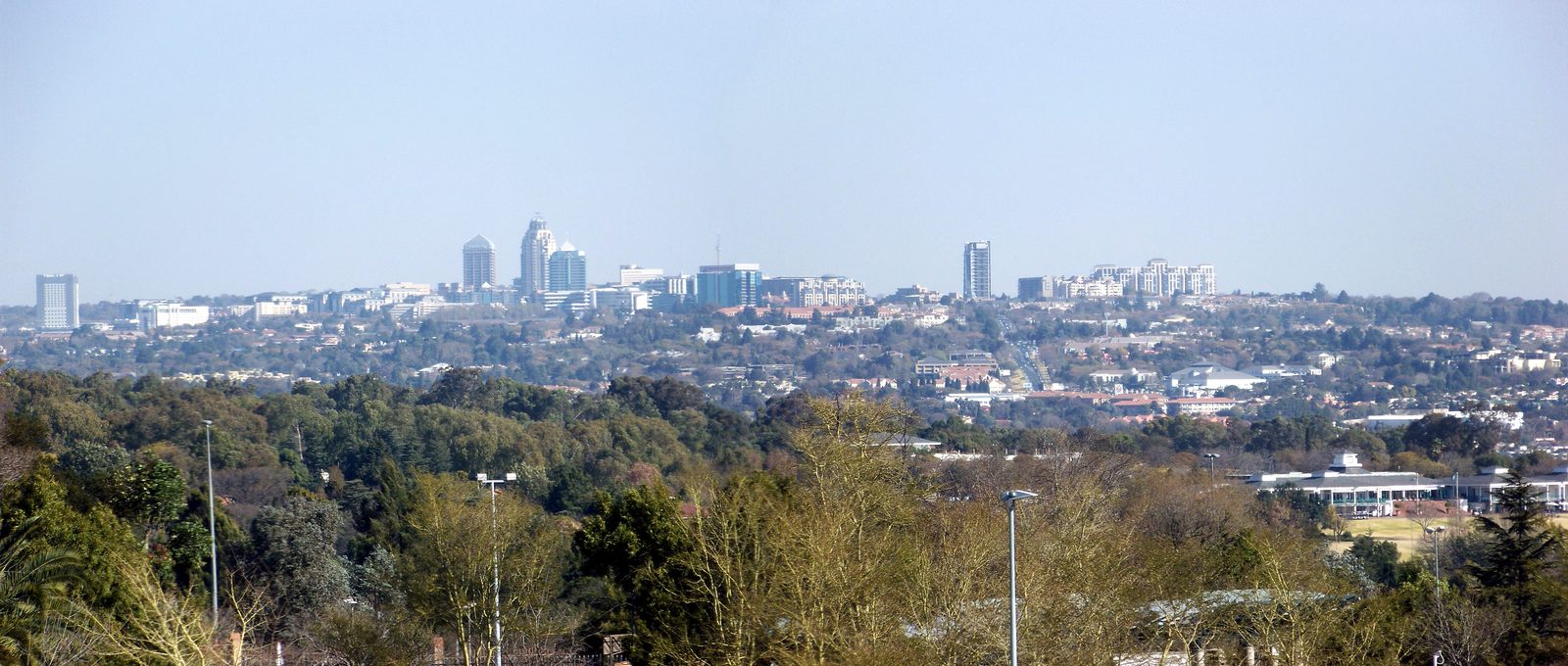 The commercial precinct of Sandton, where an altercation at a local restaurant escalated into a dual police investigation and national procurement audit. Photo: Andres de Wet / Wikimedia Commons