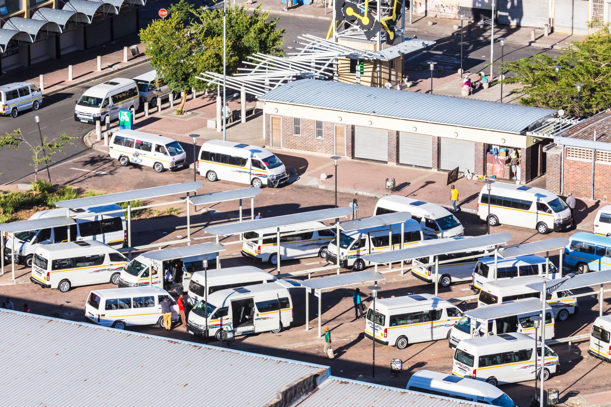 Busy South African taxi rank filled with commuter minibuses.. Source: COSMOS-120 /